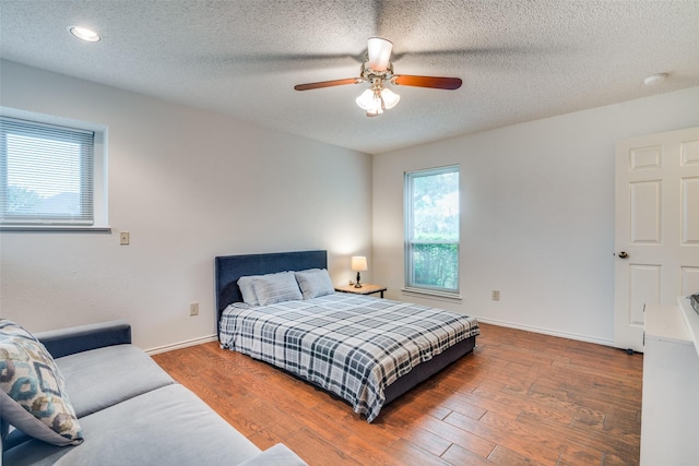 2605 Nighthawk Dr, Plano, TX 75025 - bedroom with wood finished floors, baseboards, ceiling fan, and recessed lighting