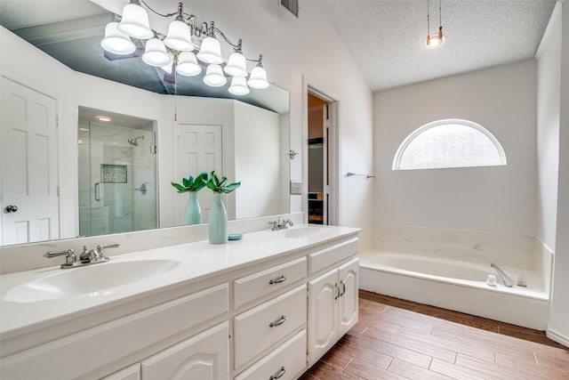 2605 Nighthawk Dr, Plano, TX 75025 - bathroom featuring a shower stall, a garden tub, visible vents, and a sink