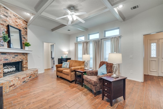 2605 Nighthawk Dr, Plano, TX 75025 - living area with beamed ceiling, visible vents, coffered ceiling, and wood finished floors