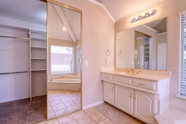 full bathroom featuring a textured ceiling, a bath, tile patterned flooring, vanity, and crown molding