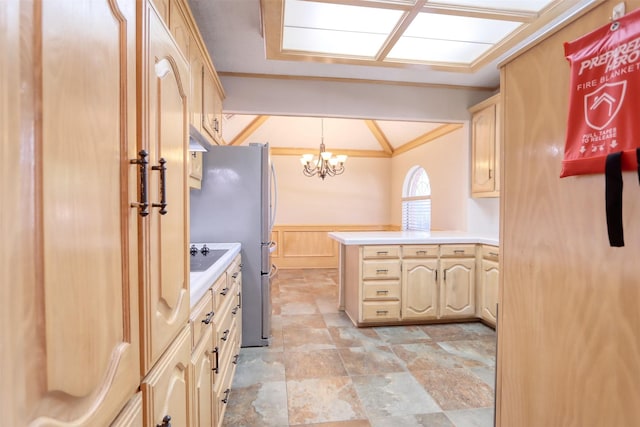 interior space featuring an inviting chandelier, crown molding, a wainscoted wall, and stone finish flooring