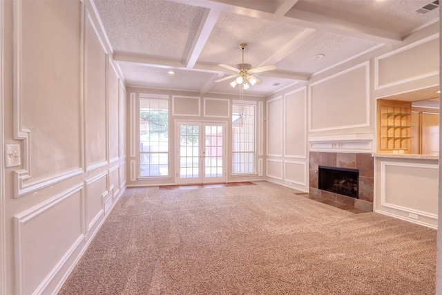 2536 Fox Glenn Cir, Bedford, TX 76021 - unfurnished living room featuring carpet flooring, a decorative wall, a ceiling fan, and visible vents