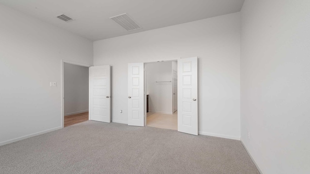 233 Pintail Ln, Rhome, TX 76078 - unfurnished bedroom featuring carpet, a spacious closet, and baseboards