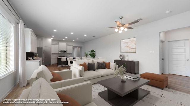 233 Pintail Ln, Rhome, TX 76078 - living room with light wood-style floors, plenty of natural light, ceiling fan, and recessed lighting