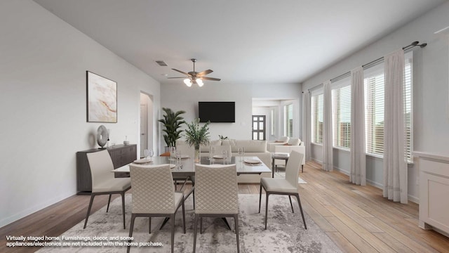 233 Pintail Ln, Rhome, TX 76078 - dining area featuring light wood finished floors, a ceiling fan, and baseboards