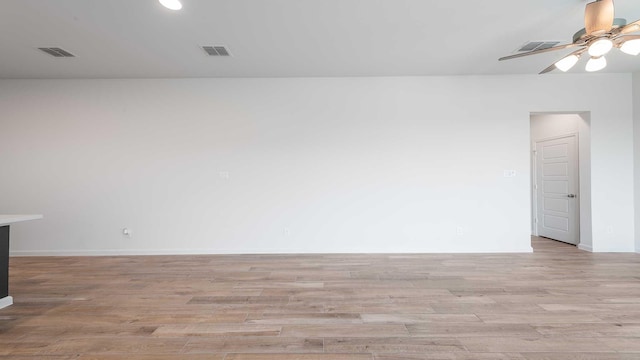 233 Pintail Ln, Rhome, TX 76078 - empty room with light wood-style flooring, a ceiling fan, baseboards, and recessed lighting