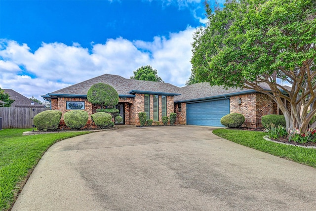ranch-style house with brick siding, concrete driveway, and a garage