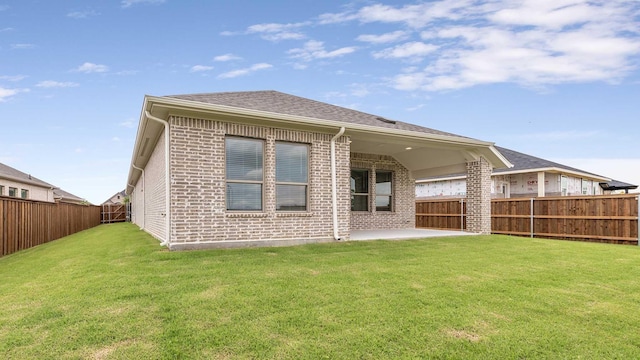 122 Palo Duro Bnd, Rhome, TX 76078 - rear view of house with a patio area, a fenced backyard, and brick siding
