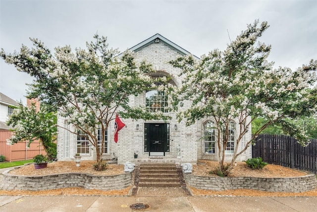 4219 Voss Hills Pl, Dallas, TX 75287 - french country style house with entry steps, fence, and brick siding