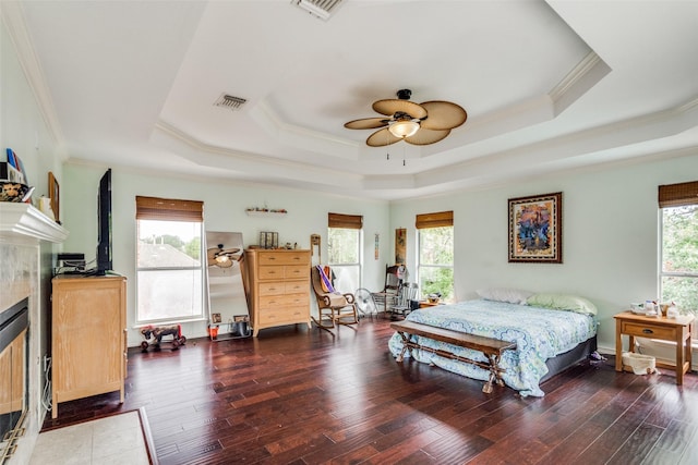 4219 Voss Hills Pl, Dallas, TX 75287 - bedroom with multiple windows, visible vents, a raised ceiling, and ornamental molding