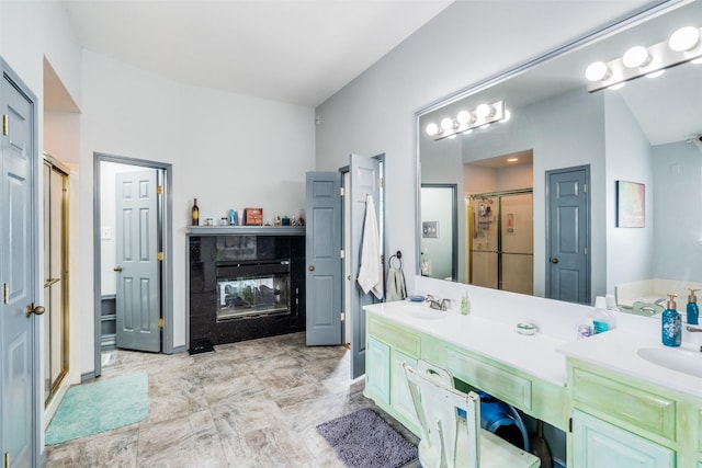 4219 Voss Hills Pl, Dallas, TX 75287 - bathroom with double vanity, marble finish floor, a stall shower, and a sink