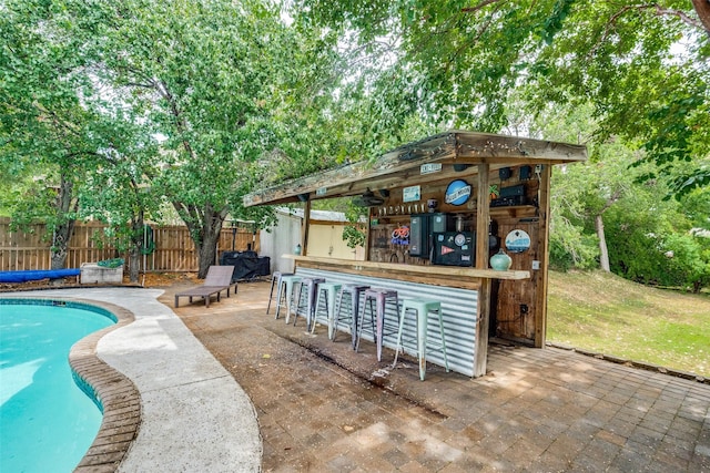 4219 Voss Hills Pl, Dallas, TX 75287 - view of swimming pool featuring fence, a patio, a fenced in pool, and outdoor dry bar