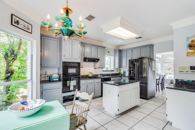 4219 Voss Hills Pl, Dallas, TX 75287 - kitchen featuring a notable chandelier, refrigerator with ice dispenser, dobule oven black, visible vents, and under cabinet range hood