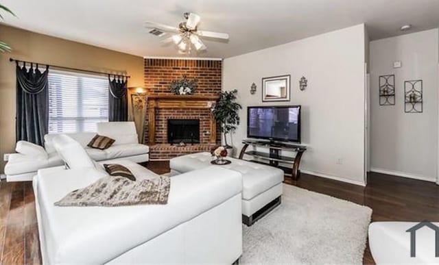 11805 Chaparral Dr, Frisco, TX 75035 - living area featuring wood finished floors, a ceiling fan, a fireplace, and baseboards