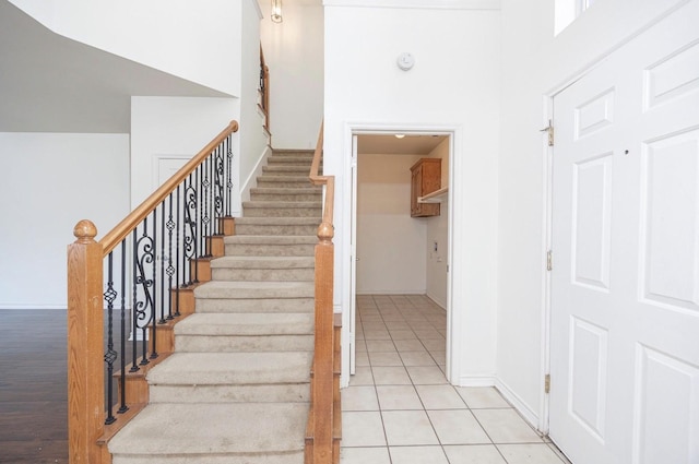 11805 Chaparral Dr, Frisco, TX 75035 - staircase featuring baseboards and tile patterned flooring