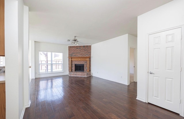 11805 Chaparral Dr, Frisco, TX 75035 - unfurnished living room featuring ceiling fan, dark wood-style flooring, a fireplace, and baseboards