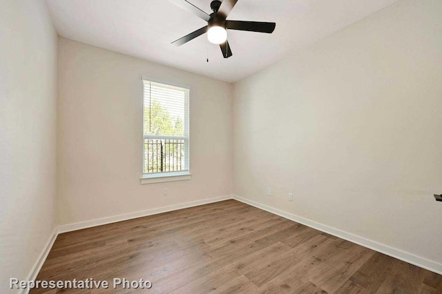 11745 Edgewood Dr, Justin, TX 76247 - unfurnished room featuring wood finished floors, baseboards, and ceiling fan