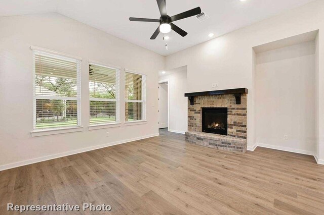 11745 Edgewood Dr, Justin, TX 76247 - unfurnished living room featuring a fireplace, ceiling fan, baseboards, and wood finished floors