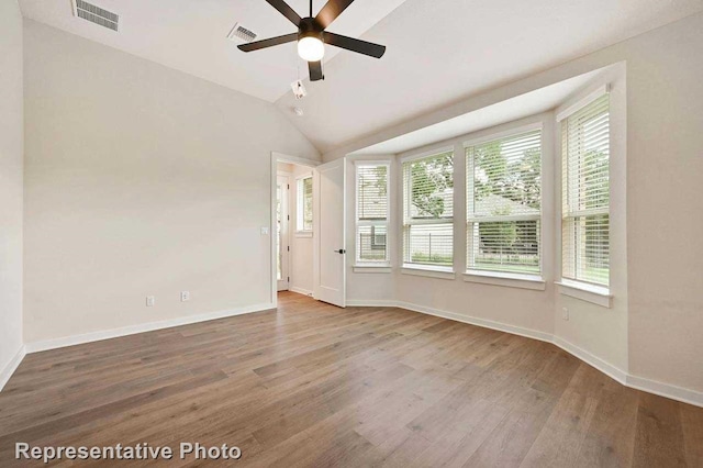 11745 Edgewood Dr, Justin, TX 76247 - unfurnished room featuring a healthy amount of sunlight, ceiling fan, visible vents, and wood finished floors