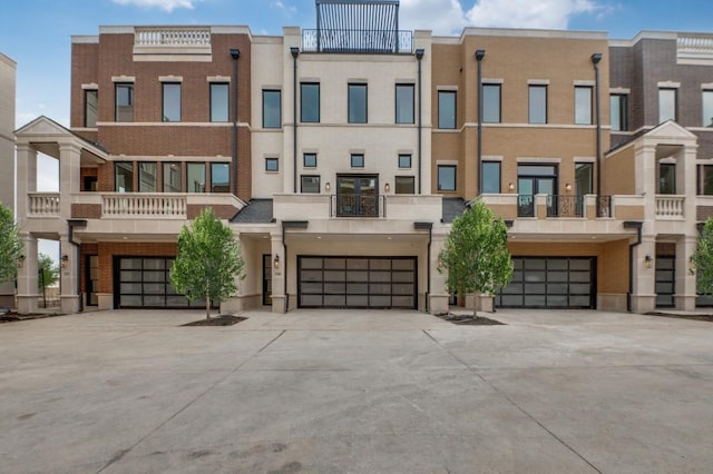 235 E Nash St Unit 118, Grapevine, TX 76051 - view of property with concrete driveway and a garage