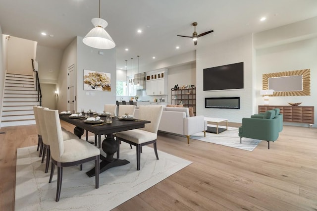 235 E Nash St Unit 118, Grapevine, TX 76051 - dining room with recessed lighting, light wood-style flooring, ceiling fan, and stairs