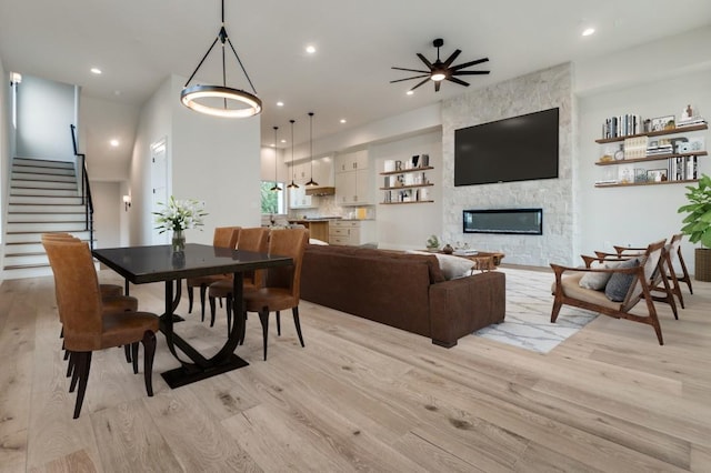 235 E Nash St Unit 118, Grapevine, TX 76051 - living room with light wood finished floors, recessed lighting, and stairs