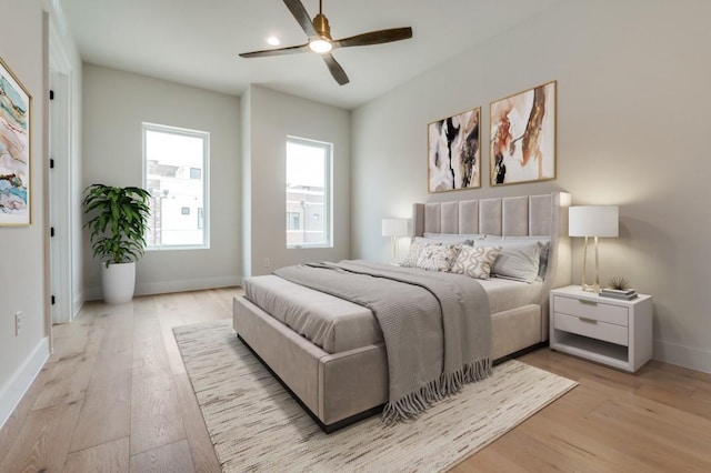 235 E Nash St Unit 118, Grapevine, TX 76051 - bedroom featuring light wood-type flooring, baseboards, and ceiling fan