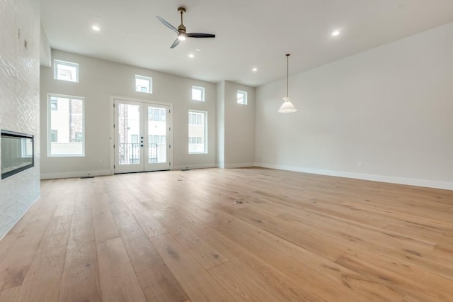 235 E Nash St Unit 118, Grapevine, TX 76051 - unfurnished living room featuring light wood-style floors, baseboards, ceiling fan, and recessed lighting