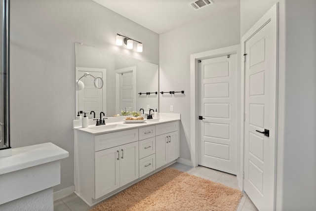 421 Hummingbird Dr, Celina, TX 75009 - full bath featuring tile patterned floors, double vanity, and baseboards