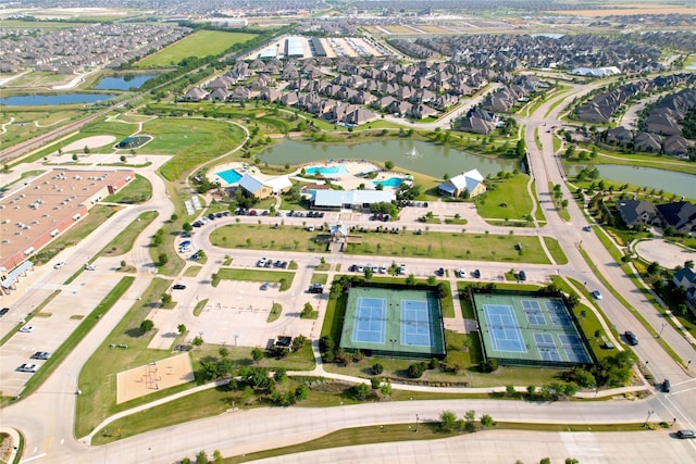 birds eye view of property featuring a water view and a residential view