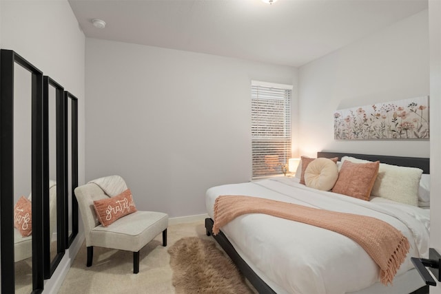 carpeted bedroom with baseboards