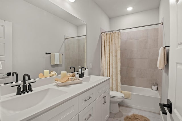 bathroom with a sink, toilet, shower / bath combo with shower curtain, and tile patterned floors