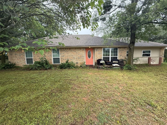 1104 County Road 701, Cleburne, TX 76031 - view of front of property with brick siding and a front yard