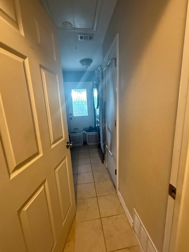 1104 County Road 701, Cleburne, TX 76031 - corridor featuring light tile patterned flooring, attic access, and visible vents