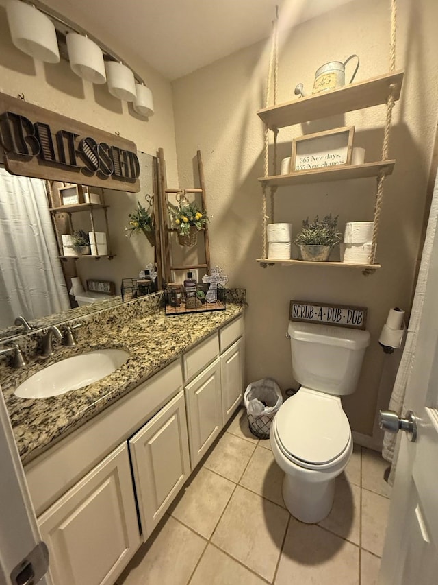 1104 County Road 701, Cleburne, TX 76031 - bathroom with toilet, tile patterned flooring, and vanity