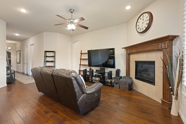 living area with ceiling fan, recessed lighting, dark wood-style floors, and a tile fireplace