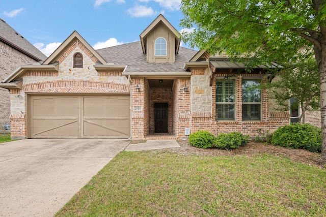 view of front facade with brick siding, driveway, a garage, a front yard, and a shingled roof