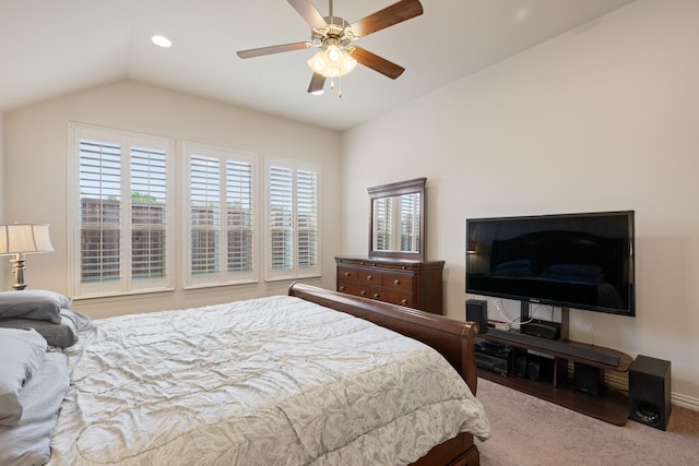 carpeted bedroom with a ceiling fan and lofted ceiling