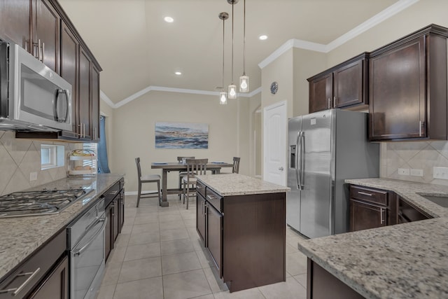 kitchen featuring dark brown cabinetry, appliances with stainless steel finishes, tasteful backsplash, and ornamental molding