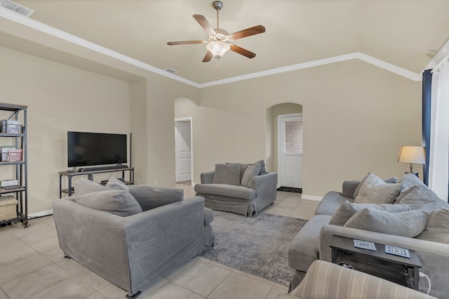 living room with light tile patterned floors, crown molding, visible vents, ceiling fan, and arched walkways