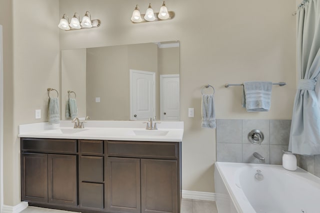 full bath featuring double vanity, a bath, tile patterned flooring, and a sink
