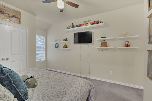 bedroom with ceiling fan, lofted ceiling, carpet flooring, and baseboards
