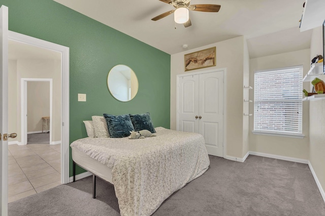 bedroom with baseboards, carpet flooring, a closet, and ceiling fan