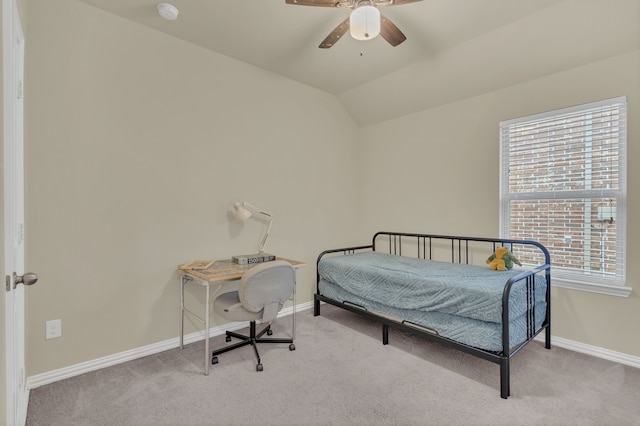 carpeted bedroom featuring vaulted ceiling, baseboards, and ceiling fan