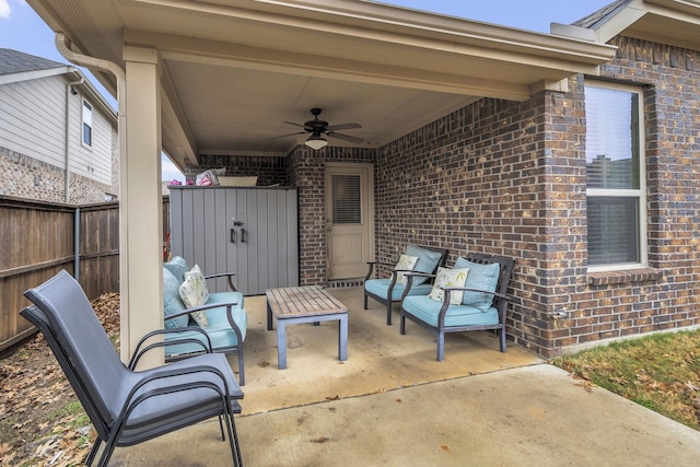 view of patio featuring fence and a ceiling fan