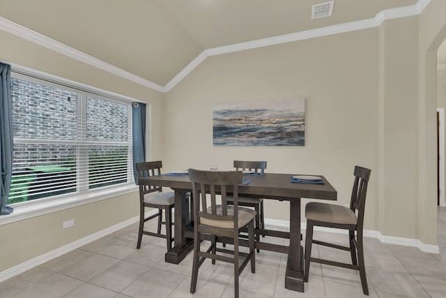 dining room featuring lofted ceiling, ornamental molding, light tile patterned floors, and visible vents