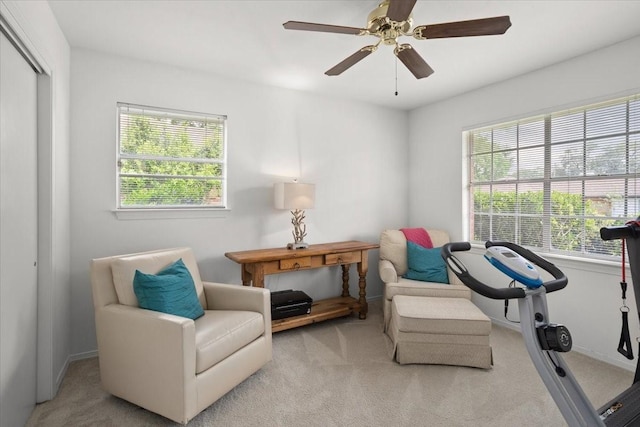 sitting room featuring carpet, plenty of natural light, and ceiling fan