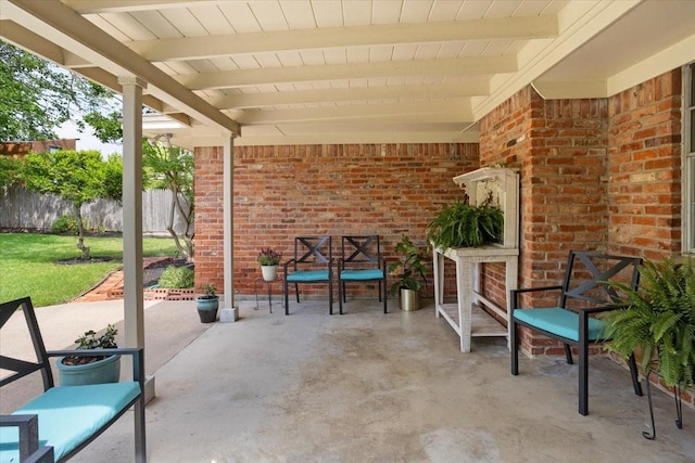 view of patio featuring fence