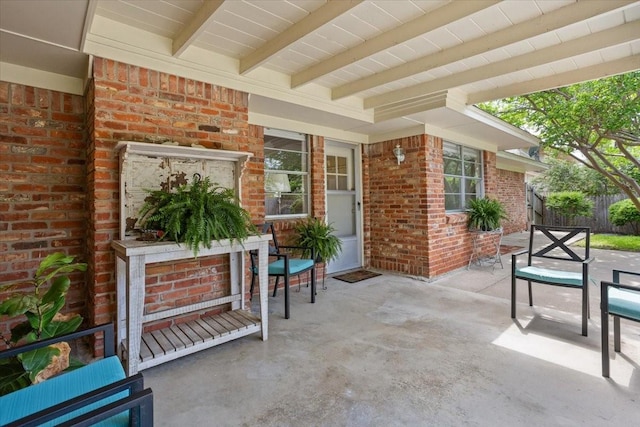 view of patio / terrace featuring fence