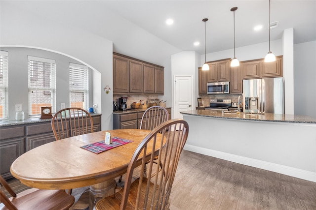 4037 Knightsbridge Ln, Midlothian, TX 76065 - dining area with light wood finished floors, vaulted ceiling, and recessed lighting